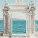 gray pillars near body of water