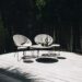 gray table with chair near trees