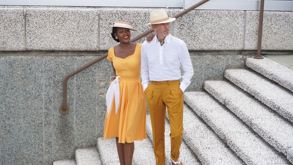 Couple in vintage clothing walking down stairs
