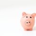 pink pig figurine on white surface