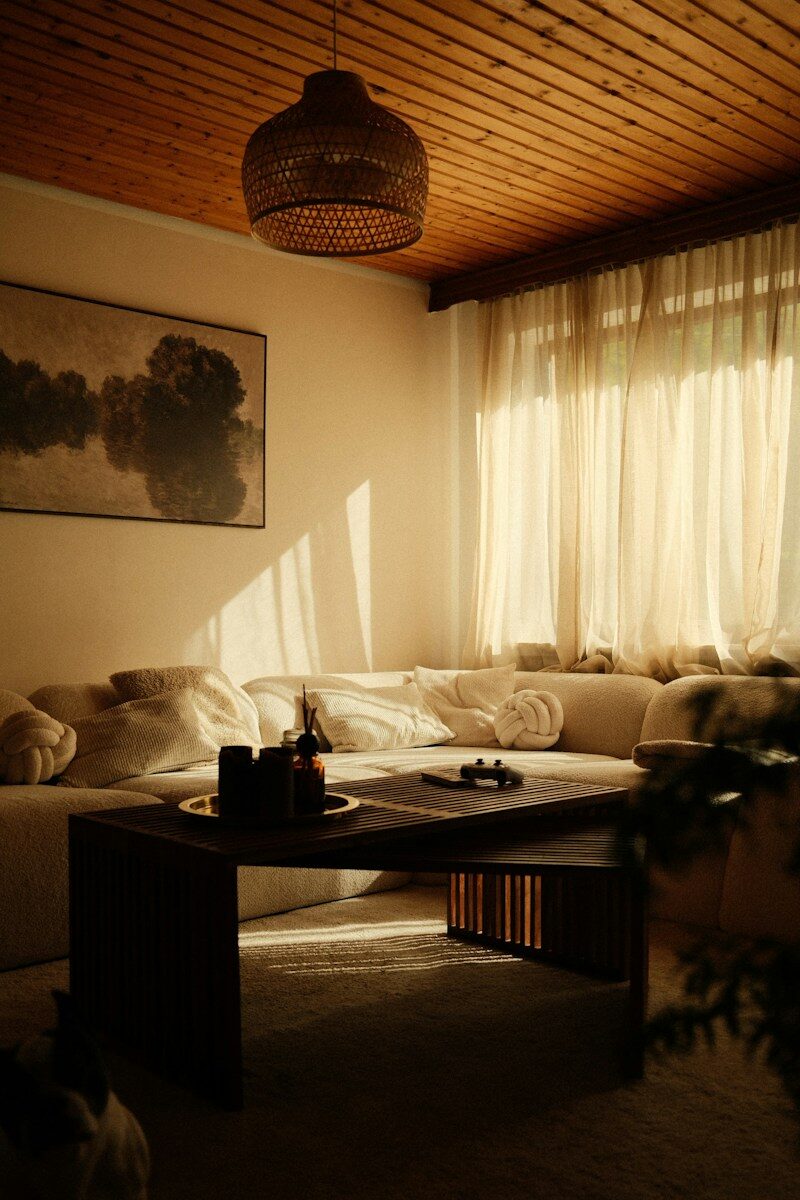 Cozy living room with sunlight streaming through sheer curtains